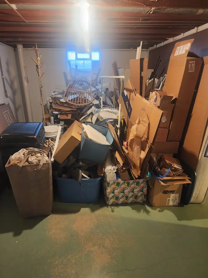 Roll-off dumpster container at job site for 2 Yard Dumpster Rental in Cary